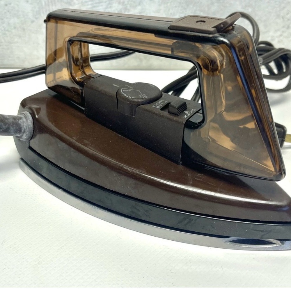 Travel compact steam iron by General Electric & travel bag.